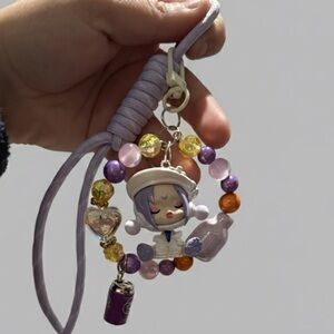 Skullpanda City of Lights Series “Mediator” bagcharm custom made by Joelle